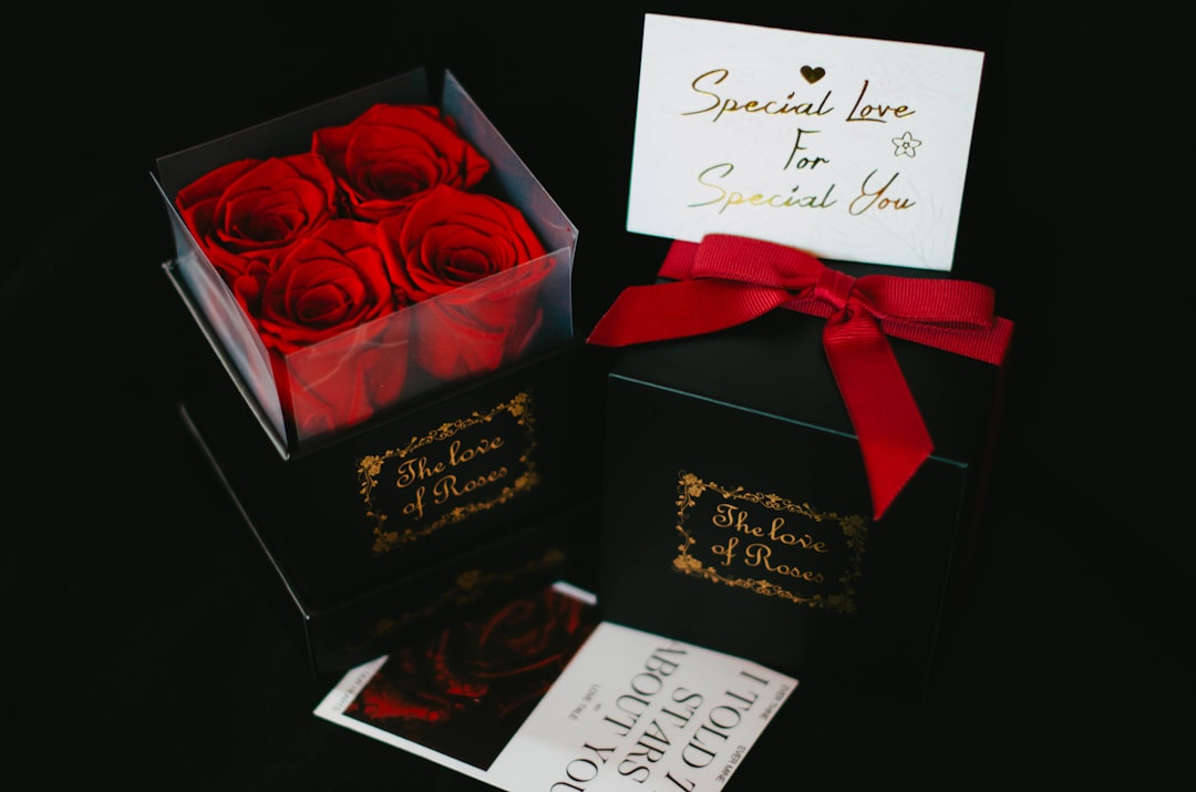 a black box with a red rose in it