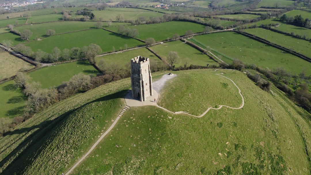 An aerial view of a castle surrounded by green fields