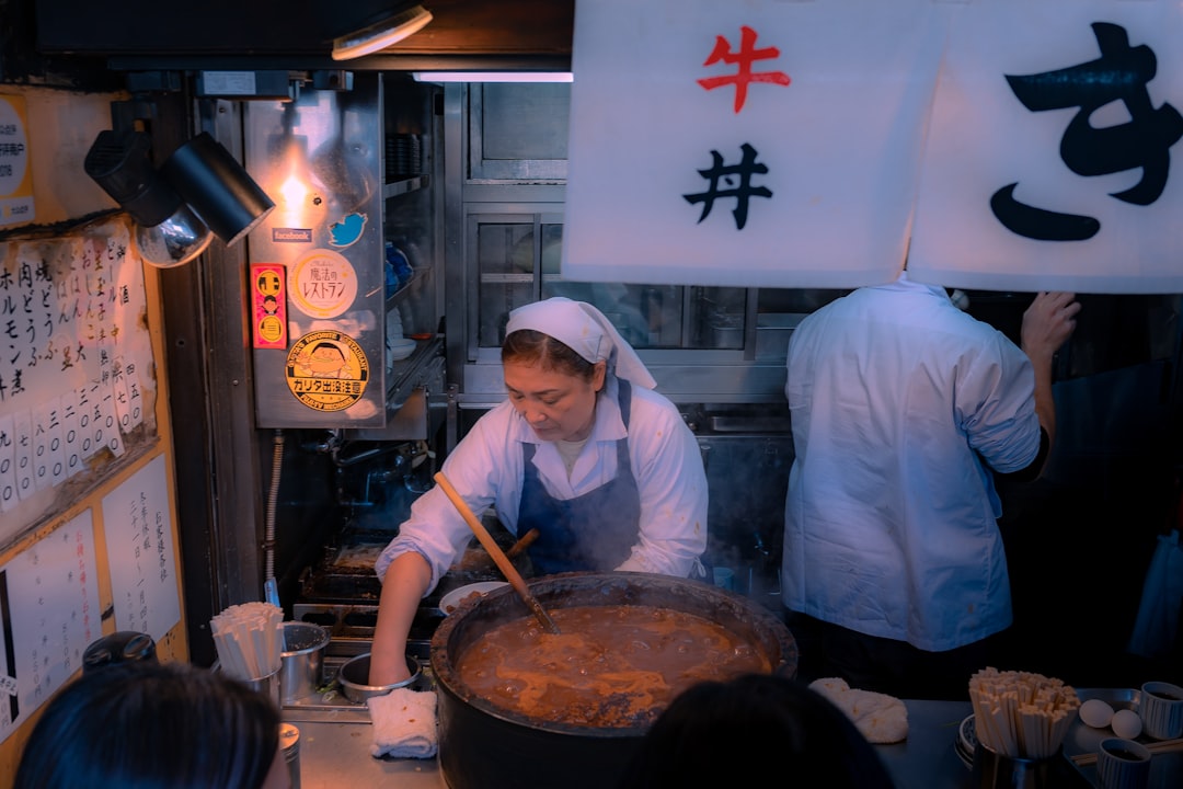 a group of people in a kitchen preparing food