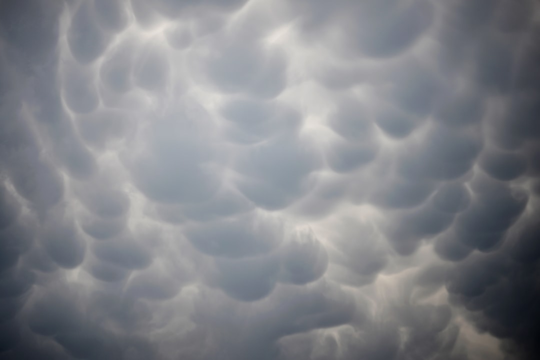 A very cloudy sky with some clouds in it