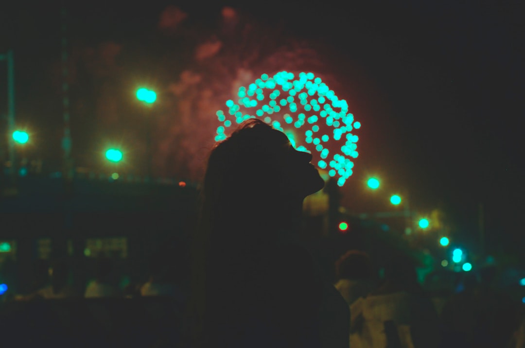 silhouette of woman standing near tree
