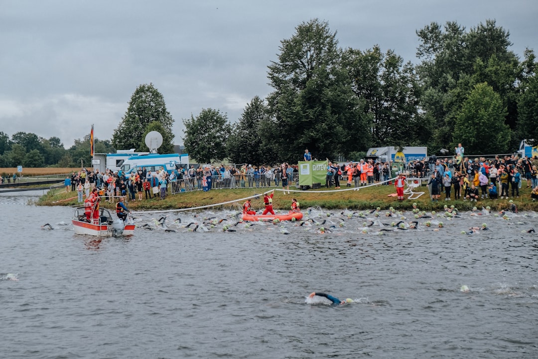 A group of people riding paddle boats on top of a lake